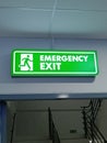 Emergency exit sign, if something dangerous happens, please proceed in the direction of the arrow Royalty Free Stock Photo