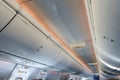 Emergency exit signs on ceiling inside an airplane Royalty Free Stock Photo