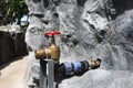 Emergency fire hydrant water station or firewater system for firefighter use on stone cement stairs for walking steps up to second