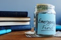 Emergency fund written on a jar with money Royalty Free Stock Photo