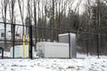 emergency generator for uninterruptible power supply behind metal fence