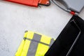 Emergency kit for car - first aid kit, car jack, warning triangle, reflective vest Royalty Free Stock Photo