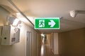 Emergency light and Emergency Fire exit sign at  the corridor Royalty Free Stock Photo