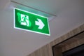 Emergency light and emergency fire exit sign hanging ceiling Royalty Free Stock Photo