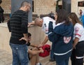 Emergency medical workers provide medical assistance to the race participant in the `Christmas Run` in Mi`ilya in Israel