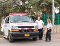 Emergency medical workers stand and talk in anticipation of the start `Cristmas Run` in Mi`ilya in Israel