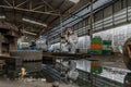 emergency pollution factory concept. Female chemist wearing PPE and gas mask inspecting oil on factory floor Royalty Free Stock Photo