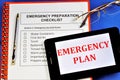 Emergency preparedness checklist.Emergency survival items.Water containers,first aid kit, torch, batteries, canned food, warm