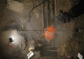 Emergency repairs. Workers welding the heating main, pipelines, using lamp