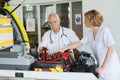 Emergency respondents preparing vehicle Royalty Free Stock Photo