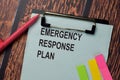 Emergency Response Plan write on a paperwork isolated on office desk