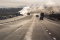 Emergency response vehicles lined up by a semi truck trailer fire on the side of a highway Royalty Free Stock Photo