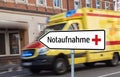 Emergency room sign with ambulance in german Royalty Free Stock Photo