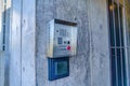Emergency security box with call button mounted on the wall of campus building