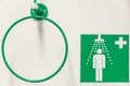 Emergency shower to wash yourself from contaminations with a medical green sign, details, closeup Royalty Free Stock Photo