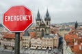 Emergency sign on Prague city center background. Financial crash in world economy because of coronavirus. Global economic crisis,