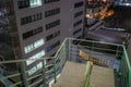 Emergency stairs between buildings at night Royalty Free Stock Photo