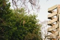 Emergency stairs of a concrete building with sky and trees as a copy space Royalty Free Stock Photo