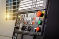 Emergency stop button depth of field, focus blur in CNC machine control panel with machining machine and late process Royalty Free Stock Photo
