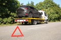 Emergency stop sign with broken car and tow truck Royalty Free Stock Photo