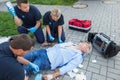 Emergency team giving firstaid to elderly patient