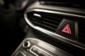 Triangle button on black car dashboard Royalty Free Stock Photo