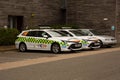 Emergency vehicles and a car parked in the parking lot Royalty Free Stock Photo