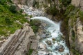 Emergency water outlet forcefully releasing into the river during the Himachal Pradesh monsoon in India