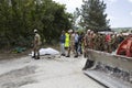 Emergency workers with bulldozer after earthquake in Pescara del Tronto, Italy