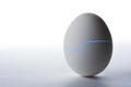 Emerging from an egg with blue glowing crack