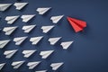 Emerging leader concept. White paper origami airplanes led by red airplane. navy blue background