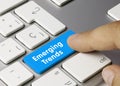 Emerging Trends - Inscription on Blue Keyboard Key