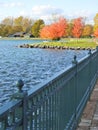 Emerson Park pier view of autumn trees that line shoreline Royalty Free Stock Photo