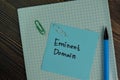 Eminent Domain write on sticky notes isolated on Wooden Table