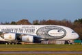 An Emirates Airbus A380 decorated with the special Museum of the Future livery on the runway at Manchester Airport