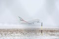 Emirates Airlines A380 taking off from snowy runway Royalty Free Stock Photo