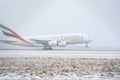 Emirates Airlines A380 taking off from snowy runway Royalty Free Stock Photo