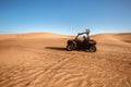 Excited girl tourist expat in helmet driving first time quad buggy bike