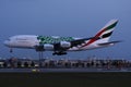 Emirates A380 plane approaching the runway, evening light