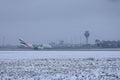 Emirates A380 plane taxiing on Munich Airport, MUC, snow