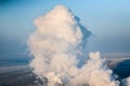 A huge cloud of steam ejected from the coke plant.