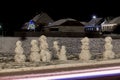 Emocional snowman`s family at december night