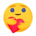 Emoji with heart in his hand. Lovely emoticon with radiant smile.. Emoji icon from Facebook App