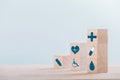 Emoticon icons healthcare medical symbol on wooden block , Healthcare and medical Insurance concept Royalty Free Stock Photo