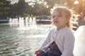 Emotion disgust face. cute Grimacing toddler girl in the park Royalty Free Stock Photo
