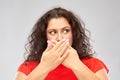 Scared woman closing her mouth by hands Royalty Free Stock Photo