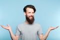 Smiling hipster man hold hands choice comparison Royalty Free Stock Photo
