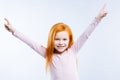 Delighted nice girl standing against blue background