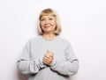 Emotion, lifestyle and old people concept: Portrait of happy smiling mature woman over white background Royalty Free Stock Photo