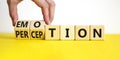 Emotion and perception symbol. Businessman turns wooden cubes and changes the word `perception` to `emotion`. Beautiful white